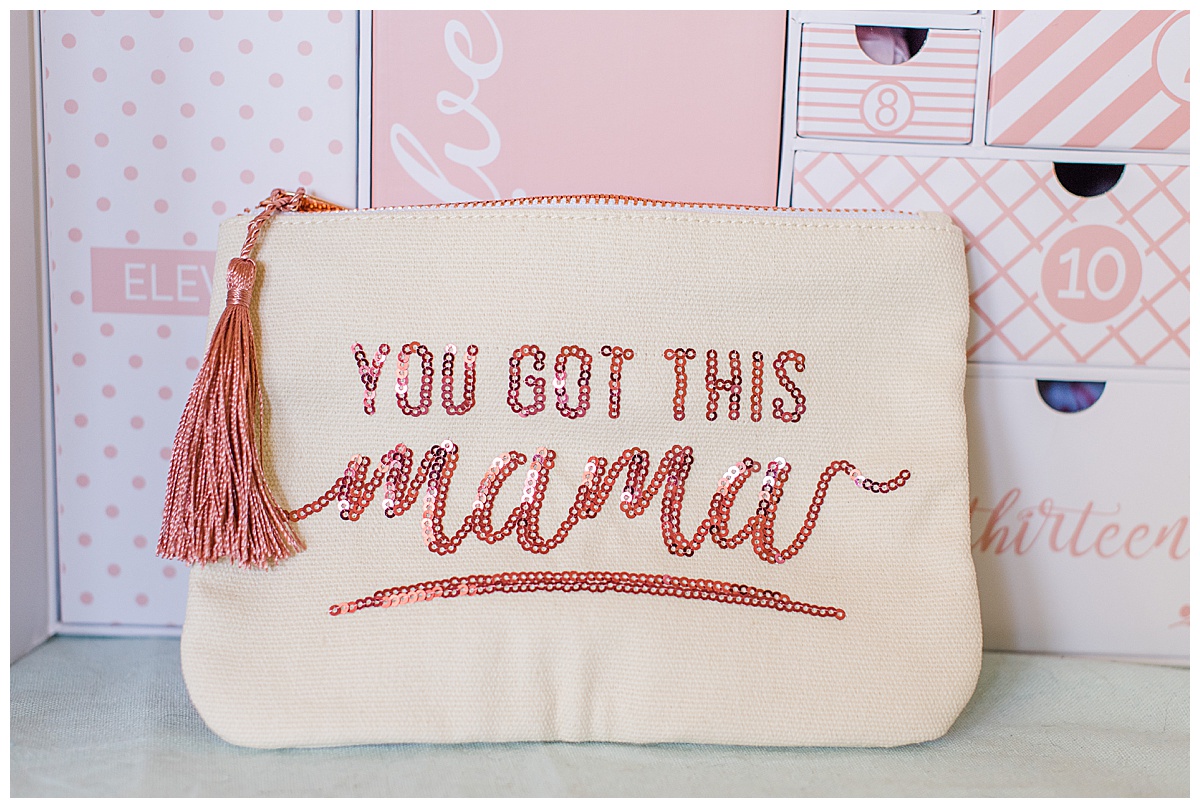 Close up of the gift in drawer number one- canvas zippered pouch with the phrase "You got this mama" in pink sequence
